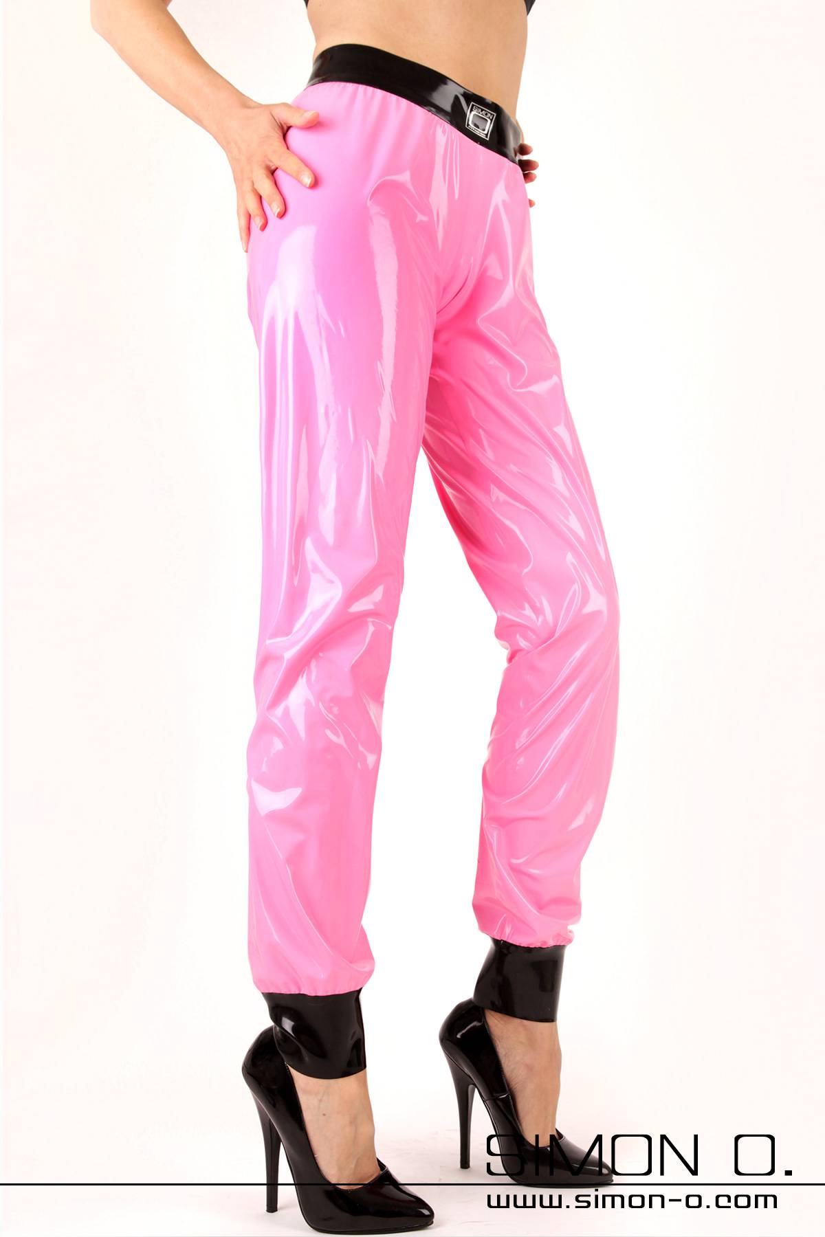 Shiny latex training pants in pink with black waistband and leg cuffs