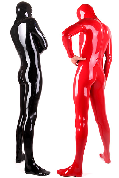 Two men in tight-fitting latex catsuits, one in shiny black and the other in shiny red, stand back to back. The suits cover them completely from head to toe, reflecting the light and emphasising their smooth texture.