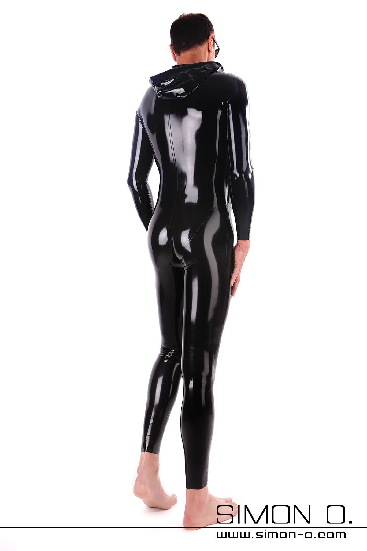 A man in a shiny black latex suit with hood from behind