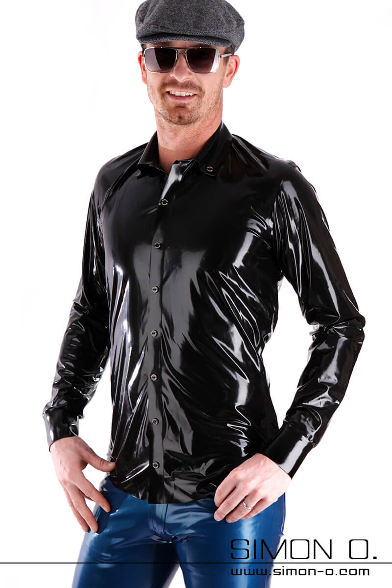 A man wears a shiny latex men shirt in black with button facing and lapel collar