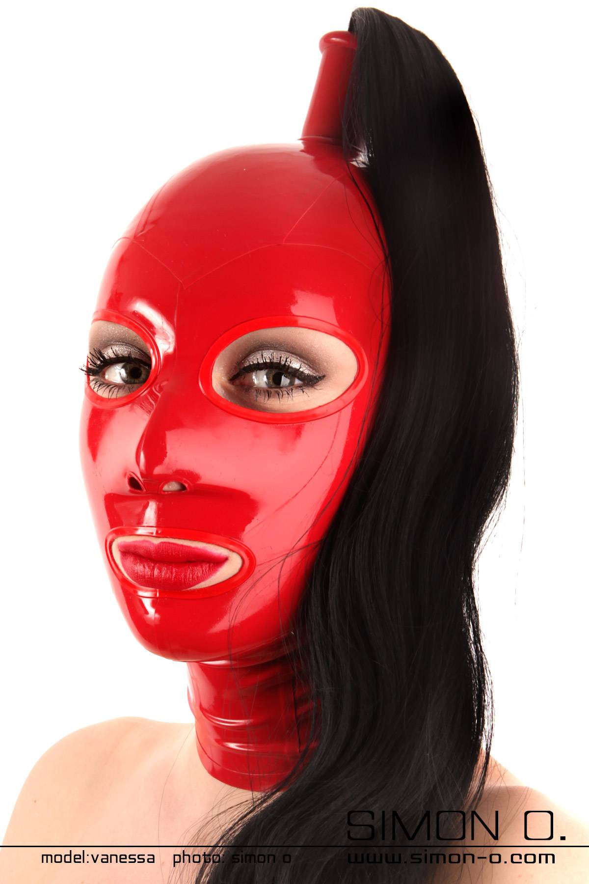 Shiny red latex hood with a black hairpiece