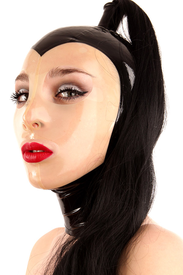 A dominatrix wears a tight latex mask with a shiny finish and black ponytail. The mask is black and has a transparent face area. Together with bold red lipstick and curved eyeliner, this look radiates a dramatic and impressive presence.