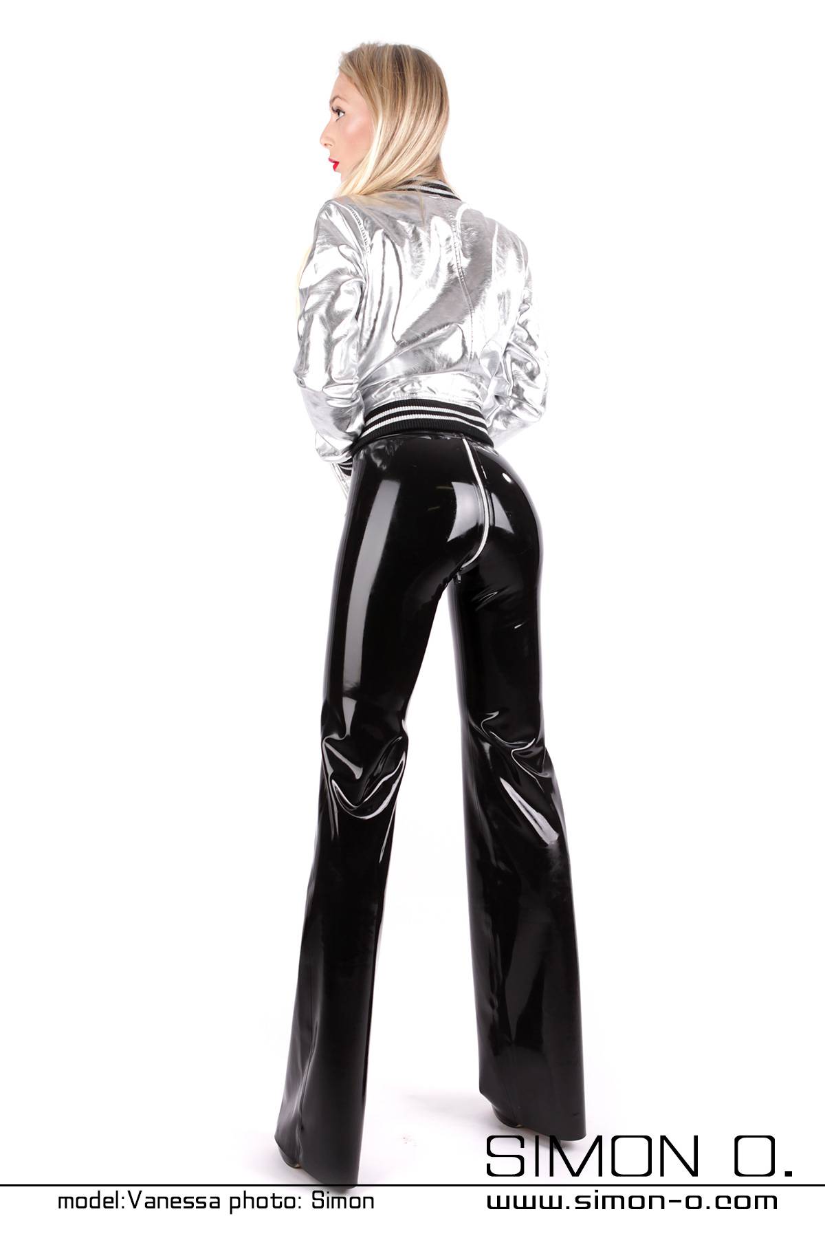 Black latex pants with wide legs and zipper in the crotch seen from behind