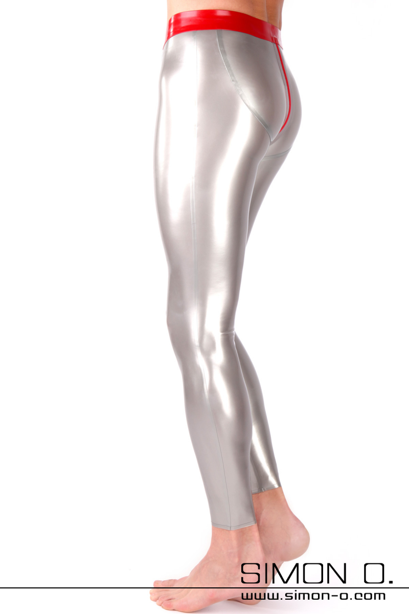 A man wearing tight shiny silver push up latex leggings with a red zipper through the crotch - seen from the side