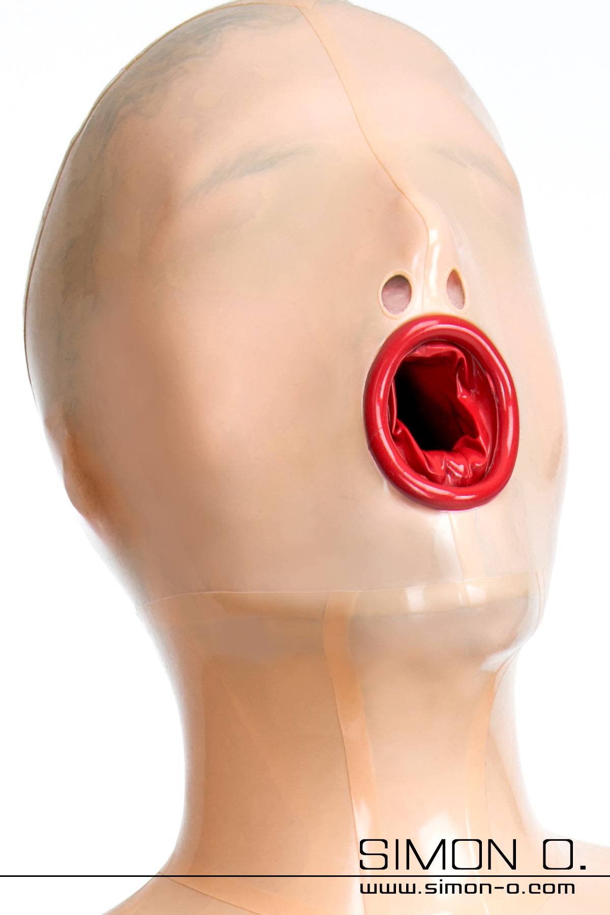 A person wearing a skin-colored latex mask. The eyes are closed and the mouth is lined with a red latex condom.