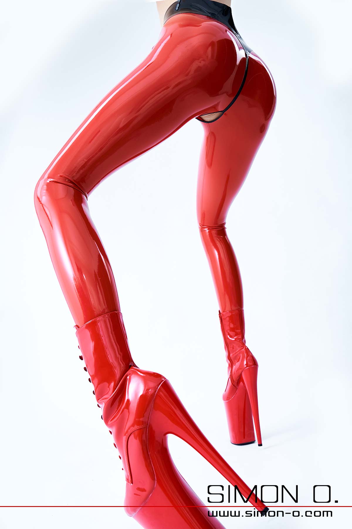 A tight fitting shiny red latex leggings with fuck slit.