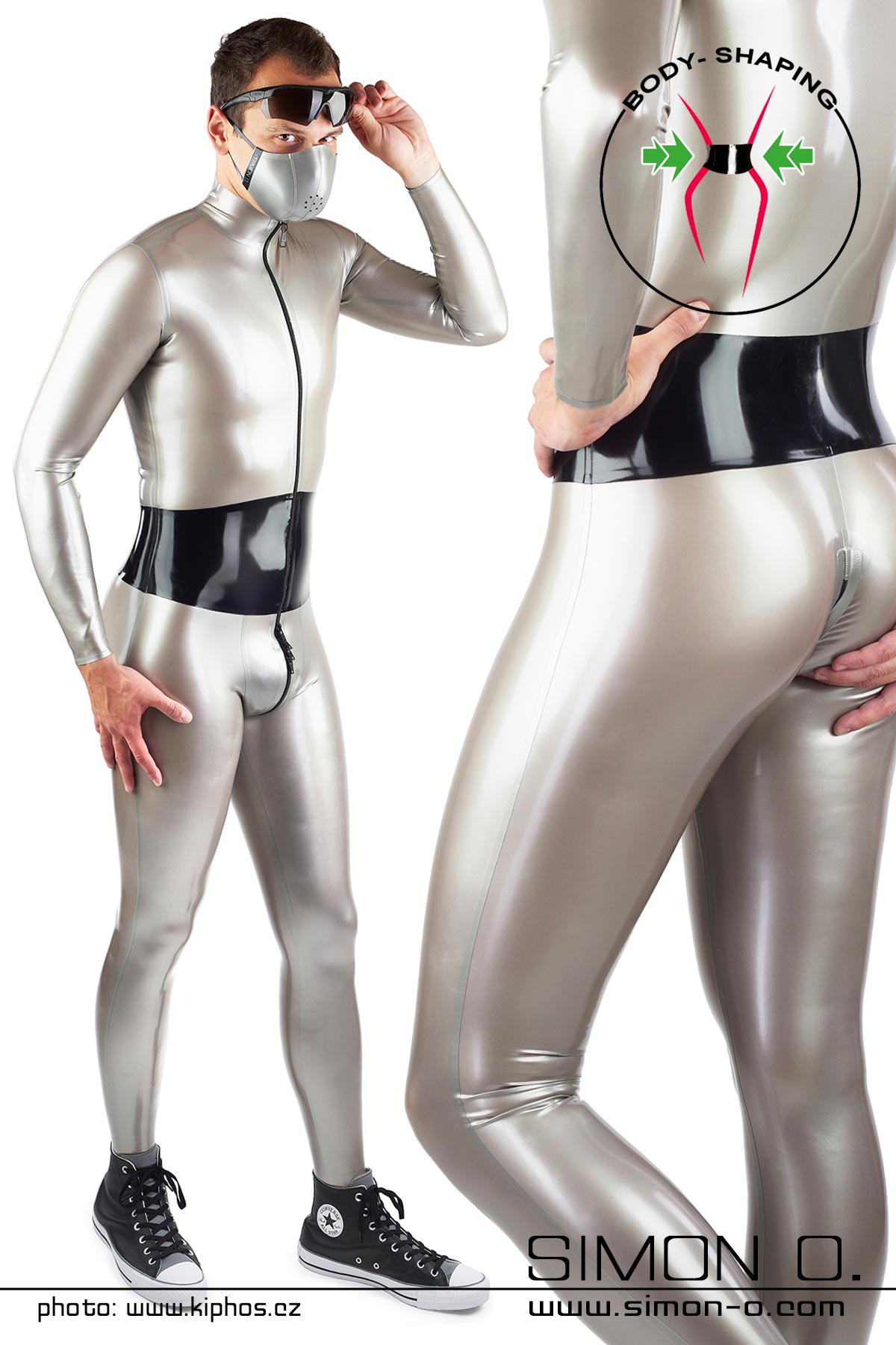 A man wears a latex catsuit in silver with an integrated wide corset belt in black.