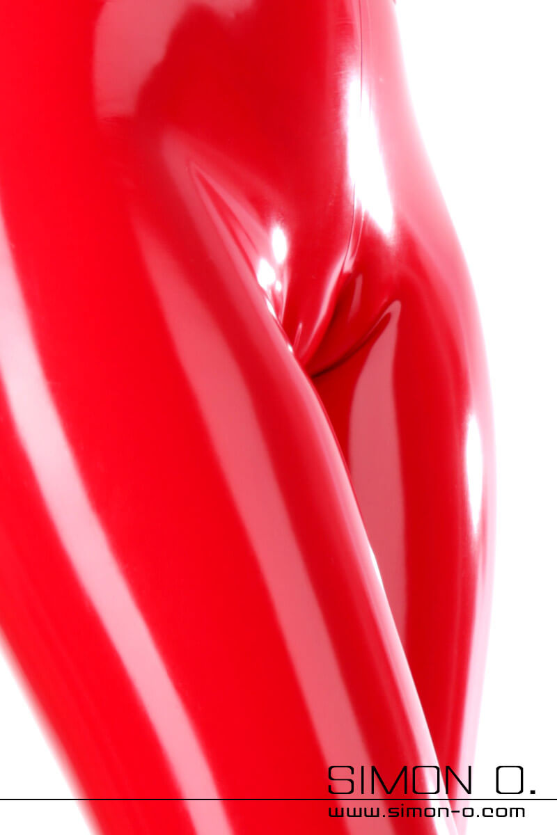 A detailed photo of red latex leggings where you can see the skin-tight fit and the cameltoe effect in the crotch.