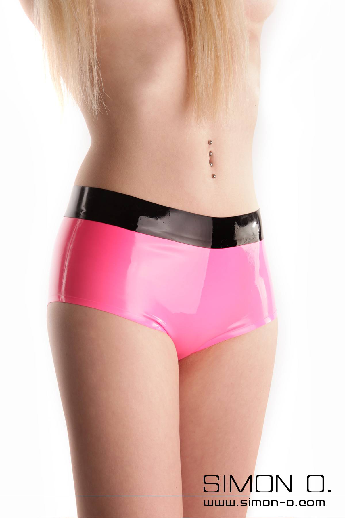 Skin tight shiny latex hot pant in pink with black waistband seen from the front