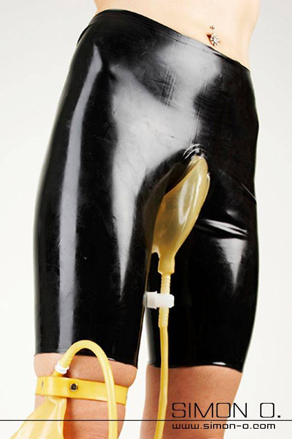 Latex trousers in black with reservoir in transparent for urine - a tube is connected to the bag which leads to a collection bag.