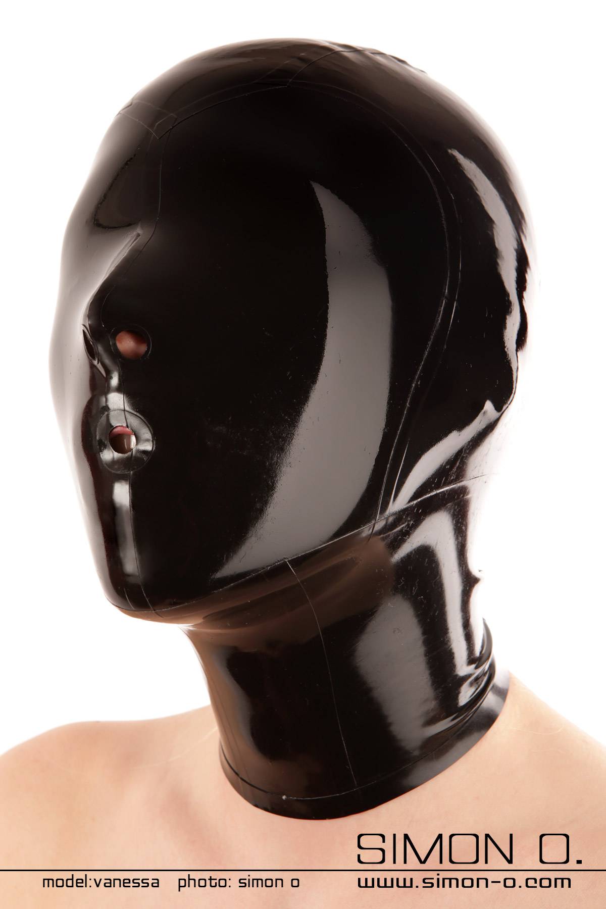 Black latex hood with closed eyes and hole at mouth for a gag outlet